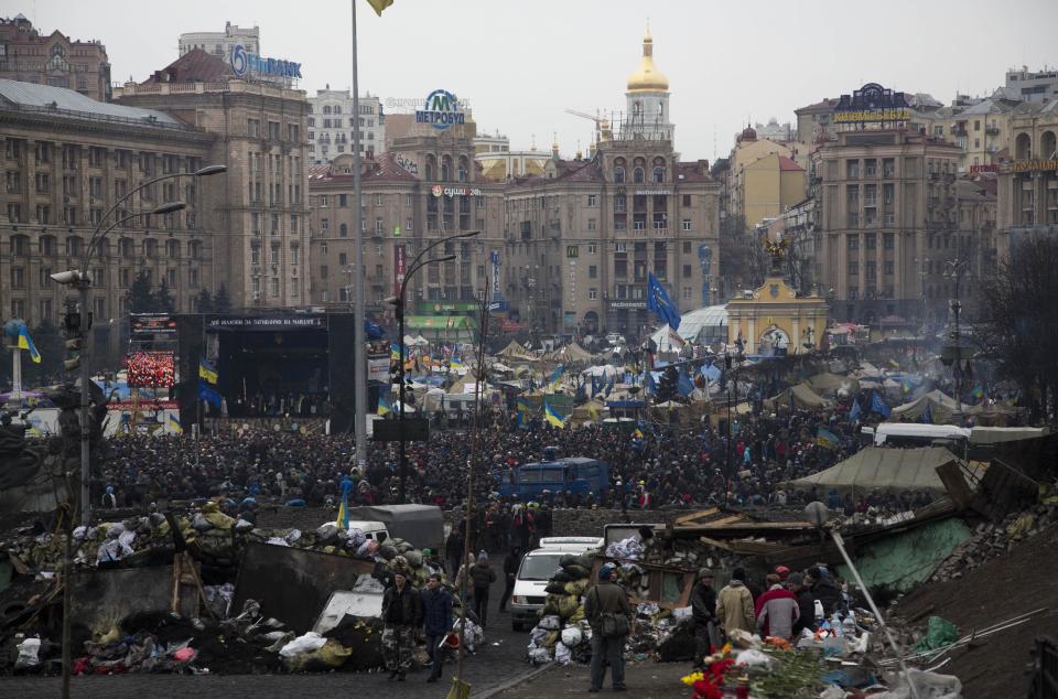 Protesters gather in the Independence square in central Kiev, Ukraine, Saturday, Feb. 22, 2014. Protesters in the Ukrainian capital claimed full control of the city Saturday following the signing of a Western-brokered peace deal aimed at ending the nation's three-month political crisis. The nation's embattled president, Viktor Yanukovych, reportedly had fled the capital for his support base in Ukraine's Russia-leaning east. (AP Photo/Darko Bandic)