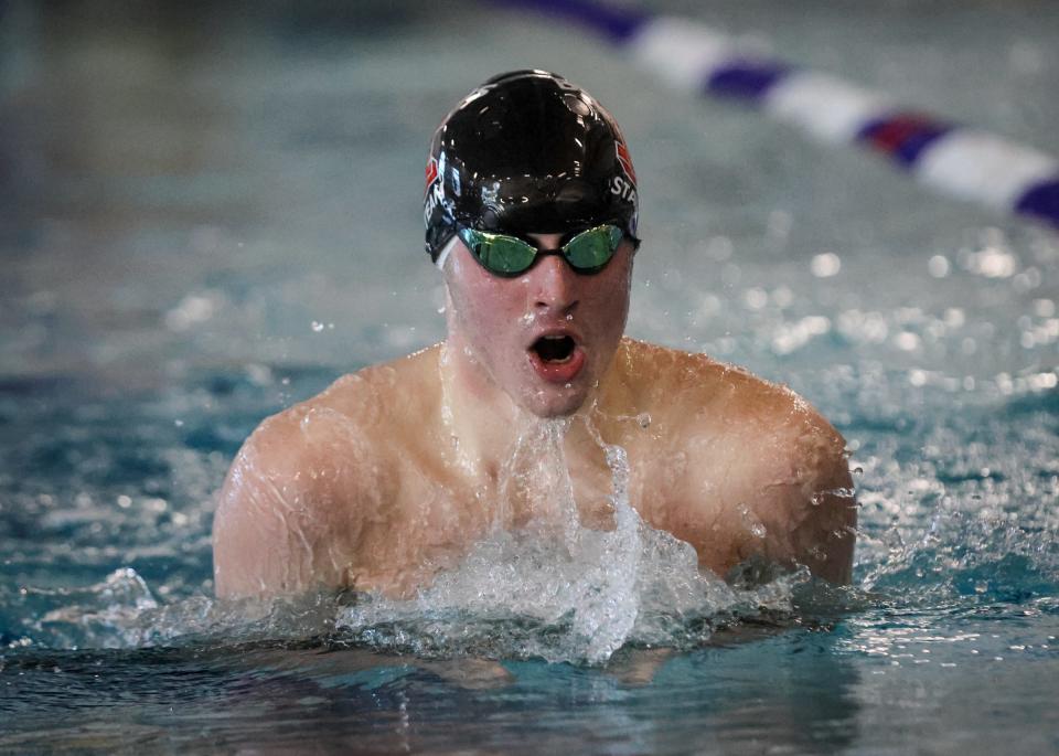 Milan's Zachary Heikka swims the breaststroke leg of the 200-yard IM during the Monroe County Championship Saturday, February 4, 2023 at Dundee High School. He won the event.