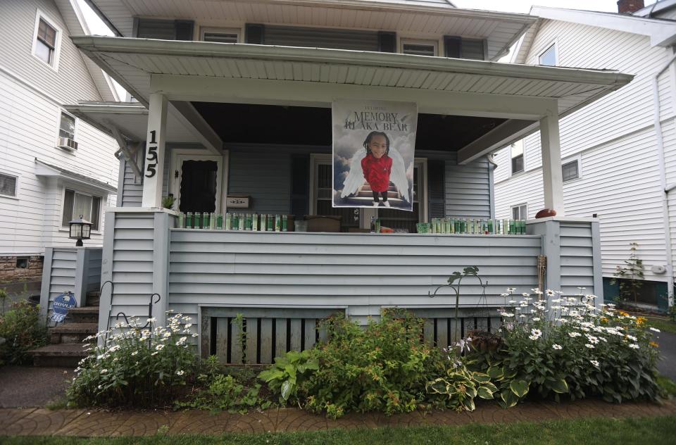 Farasa Brown has a large image and candles on her front porch in memory of her son Ryan Grantham Jr. who was fatally struck by a vehicle in June on Thurston Road. They live just blocks away.