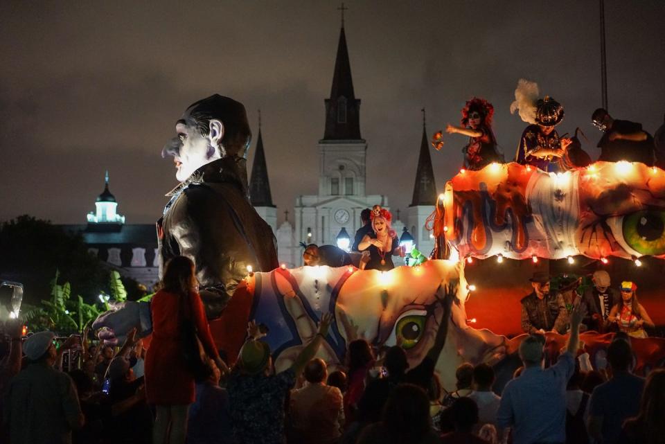 dracula parade float carries costumed revelers through new orleans streets at krewe of boo, a top halloween festival in us