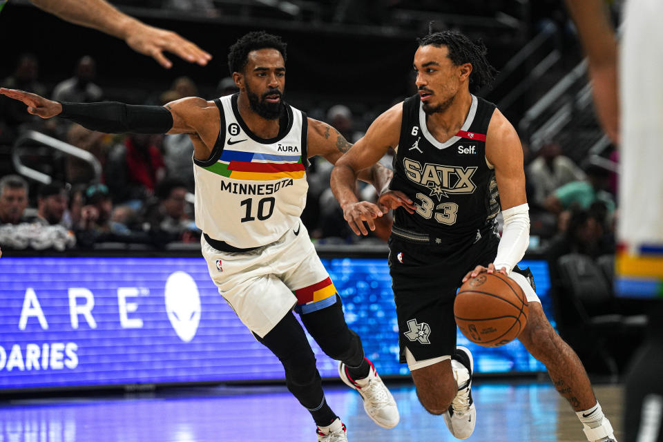 Minnesota Timberwolves guard Mike Conley (10) guards San Antonio Spurs guard Tre Jones (33) during the game at the Moody Center on Saturday, April 8, 2023 in Austin.