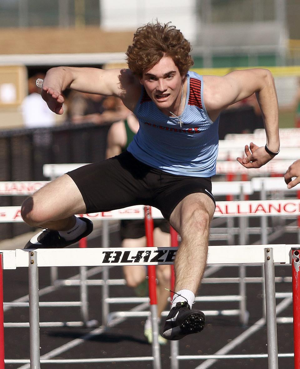 Alliance's Brendan Zurbrugg clears the last hurdle in the boys' 110-meter hurdles during Tuesday's track & field meet against West Branch.