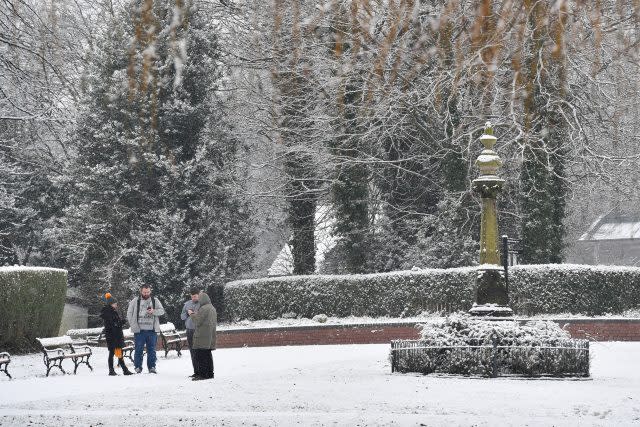 People in snow covered Stamford Park in Ashton-Under-Lyne, Greater Manchester. (Anthony Devlin/PA)