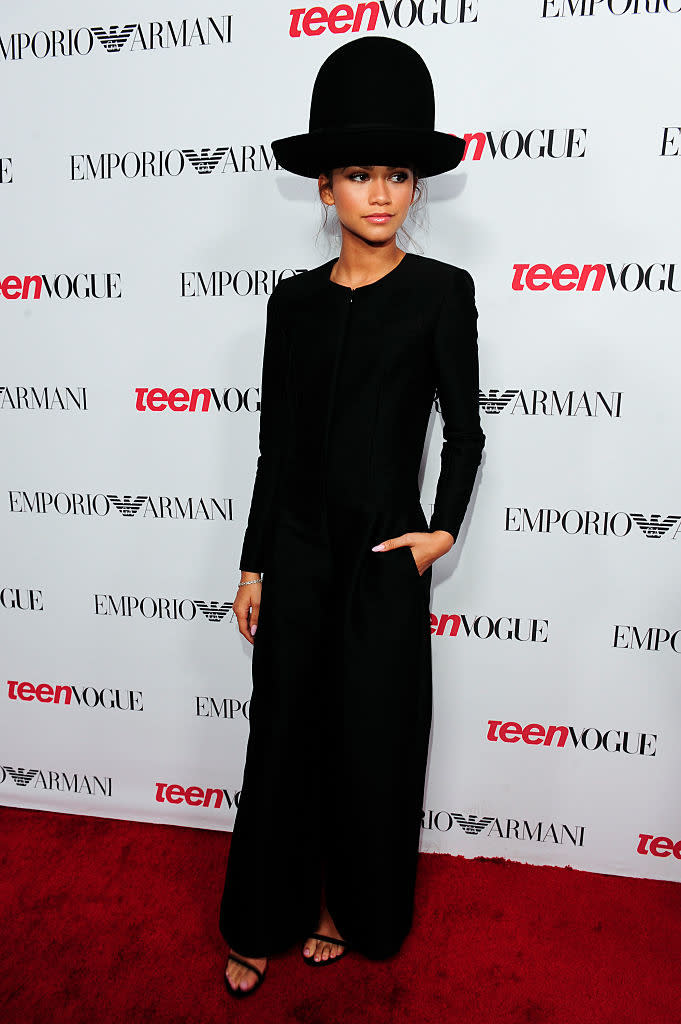 Zendaya in a flowy outfit with a wide-brimmed hat poses at a Teen Vogue event