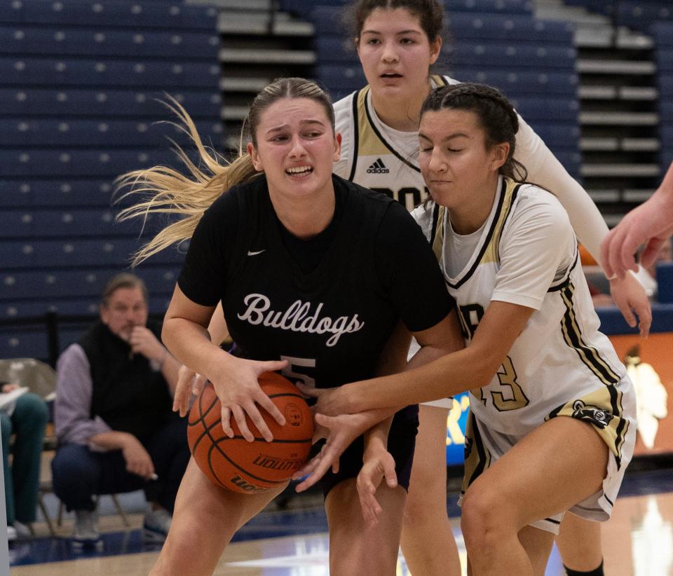 Rumson Raquel Guidetti tries to keep hold of ball as Pt. Bro Emily Marinelli tries to steal it. Rumson-Fair Haven Girls basketball vs Point Pleasant Borough in 2023 WOBM Christmas Tournament opening round in Toms 
River on December 26, 2023.