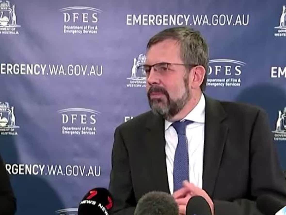 Dr. Andrew Robertson, Western Australia's chief health officer, speaks to reporters on Friday about the possible dangers of coming into contact with the lost radioactive capsule. It appears to have been lost during transportation from a mine in Western Australia last week.  (Reuters - image credit)