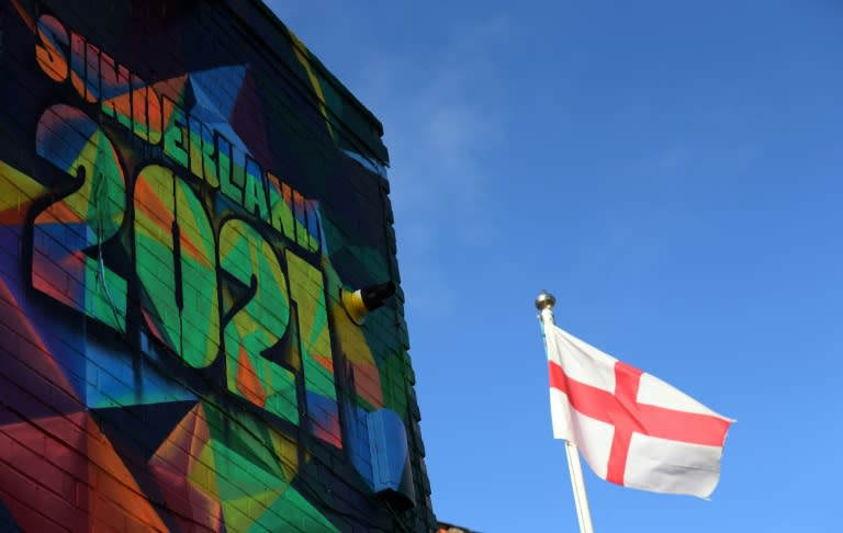 A St George's cross flag flies by a mural promoting Sunderland's bid to be 2021 UK City of Culture