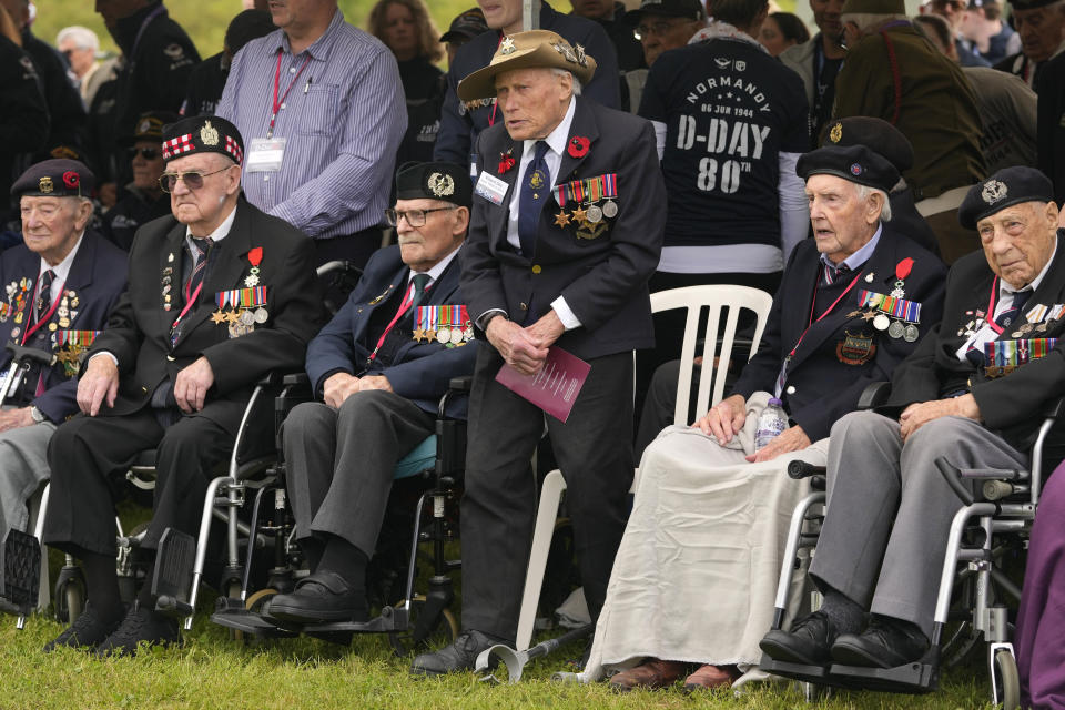 British World War II veterans attend a service at the Pegasus Bridge memorial in Benouville, Normandy, France, Wednesday, June 5, 2024. World War II veterans from across the United States as well as Britain and Canada are in Normandy this week to mark 80 years since the D-Day landings that helped lead to Hitler's defeat. (AP Photo/Virginia Mayo)