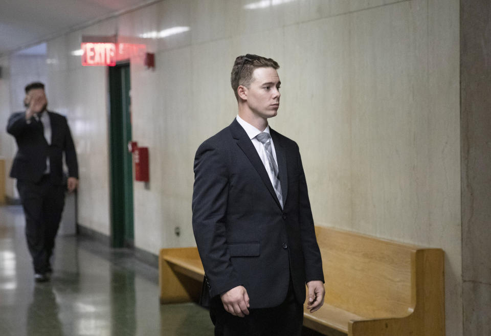 Maxwell Hare, center, and John Kinsman, left, arrive at court during their trial in New York. The two members of the far-right Proud Boys group were convicted for their roles in a violent clash with left-wing protesters in October 2018 following a speech at the Metropolitan Republican Club in New York.&nbsp; (Photo: AP Photo/Mark Lennihan, File)