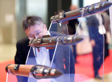 A man looks at models of Lockheed Martin's PAC-3, PAC-3 MSE and THAAD missiles during Japan Aerospace 2016 air show in Tokyo, Japan, October 12, 2016. REUTERS/Kim Kyung-Hoon/File Photo