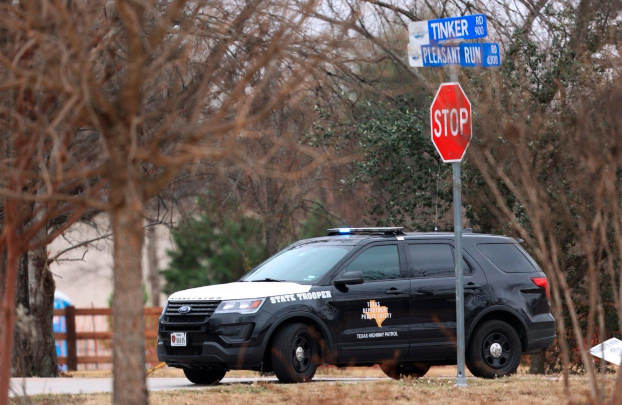 Police secure the area around Congregation Beth Israel synagogue on Saturday, Jan. 15, 2022 in Colleyville, Texas.   Authorities say a man has apparently taken hostages at the synagogue near Fort Worth, Texas. The Colleyville Police Department tweeted Saturday afternoon that it was conducting SWAT operations at the address of Congregation Beth Israel.