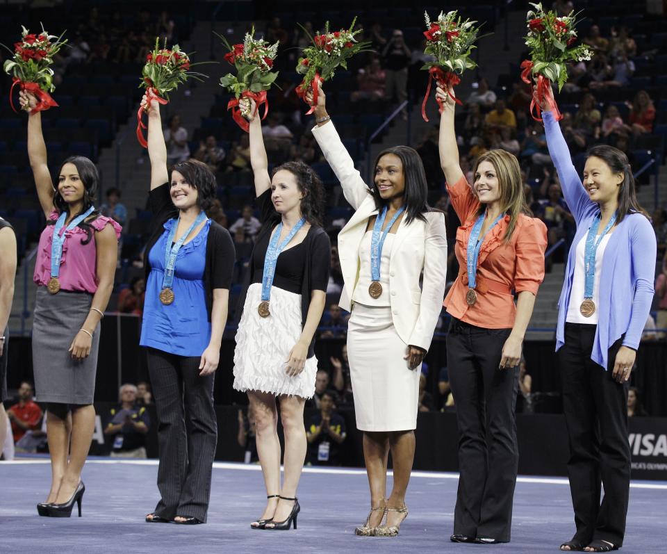 Chow graduated from Stanford University’s medical school in 2007 and is now a pediatrician. In July 2010, she married Jason Ho, an orthopedic surgeon. She is a competitive diver, and missed competing for a berth to the 2011 U.S. national diving championships due to an injury. In 2010, the IOC ruled that one member of China’s bronze-medal winning 2000 team was underage, causing the IOC to strip the Chinese of their bronze and award it to the then-fourth place U.S. team. In this photo, Chow (far right) and the rest of the 2000 team belatedly receive their medals. (AP Photo/Charles Krupa)