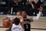 Oklahoma City Thunder's Danilo Gallinari, front, loses control of the ball to Houston Rockets' Russell Westbrook (0), right, as Steven Adams, rear, looks on during the second half of an NBA first-round playoff basketball game in Lake Buena Vista, Fla., Wednesday, Sept. 2, 2020. (AP Photo/Mark J. Terrill)