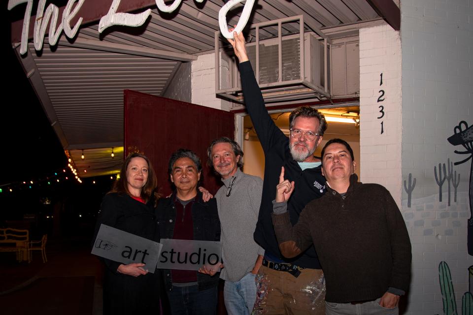 Artists Abbey Messmer, Rafael Navarro, Joe Brklacich, Bill Dambrova and Fausto Fernandez pose for a photo outside The Lodge Art Studio in Phoenix on Dec. 15, 2021.