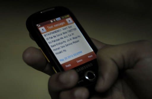 A Pakistani is seen reading a message on his cellphone refering to the blocked social networking site Twitter, in Quetta. The website, which is widely used in Pakistan, was blocked by the telecoms authority on the orders of the IT ministry, with authorities accusing Twitter of refusing to remove "blasphemous material" about a Facebook contest