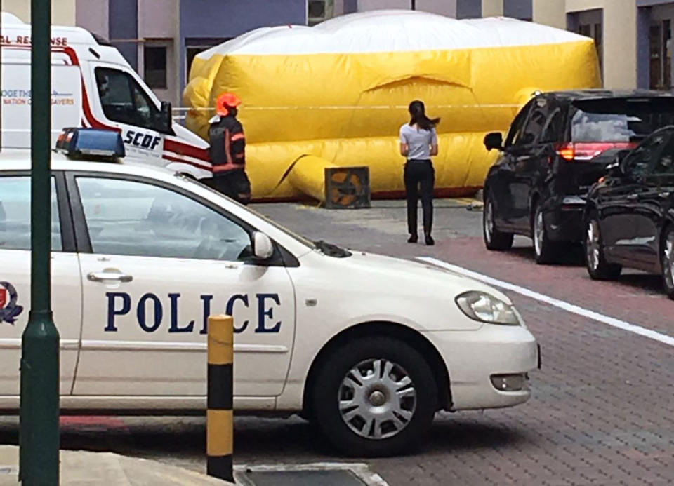 An inflatable placed at the ground level of Blk 114 Ho Ching Road on 20 March 2018. Photo: Eyewitness Yashoda Hosabettu