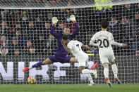 Manchester City's Raheem Sterling scores his side's first goal during the English Premier League soccer match between Watford and Manchester City at the Vicarage Road Stadium in Watford, England, Saturday, Dec. 4, 2021.(AP Photo/Ian Walton)