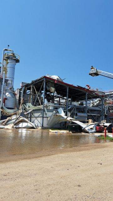 Sheets of metal siding and insulation hang off of Ringneck Energy's main process building in Onida, South Dakota on Sunday, July 9, 2023.