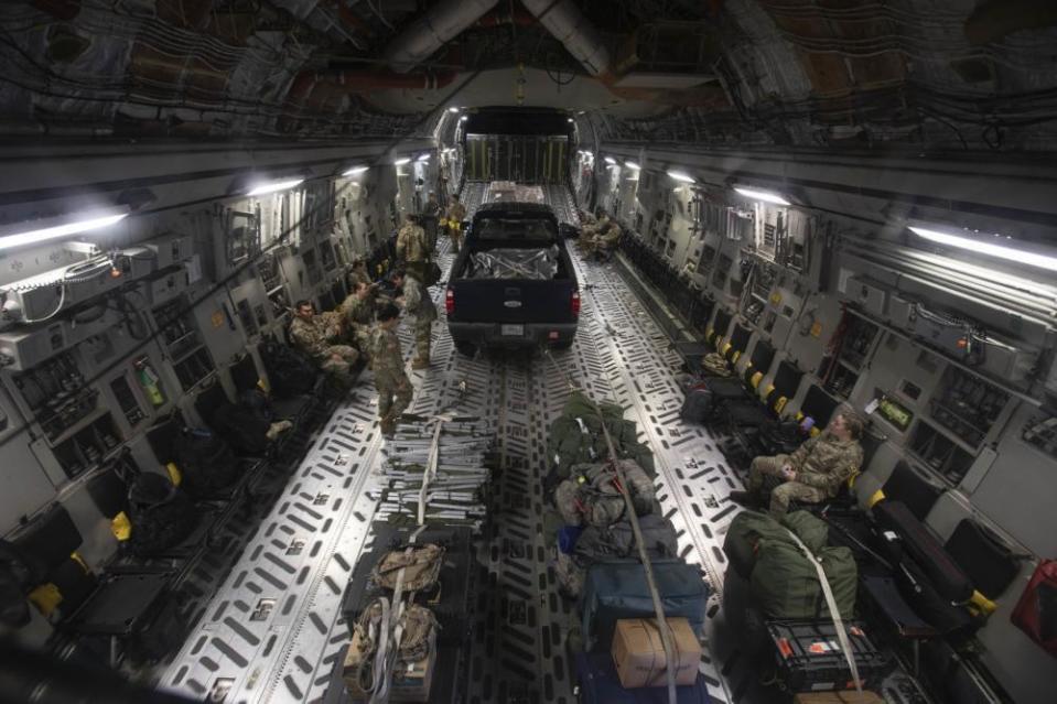 In this photo provided by the Alaska National Guard, soldiers of the Alaska Army National Guard board an C-17 Globemaster III at Joint Base Elemendorf-Richardson, Alaska, Wednesday, Sept. 21, 2022. Approximately 100 members of the Alaska Organized Militia, comprised of the Alaska National Guard, Alaska State Defense Force and Alaska Naval Militia, were activated following a disaster declaration issued Sept. 17 after remnants of Typhoon Merbok caused flooding across more than 1,000 miles of the Alaskan coastline. (Victoria Granado/U.S. Army National Guard via AP)