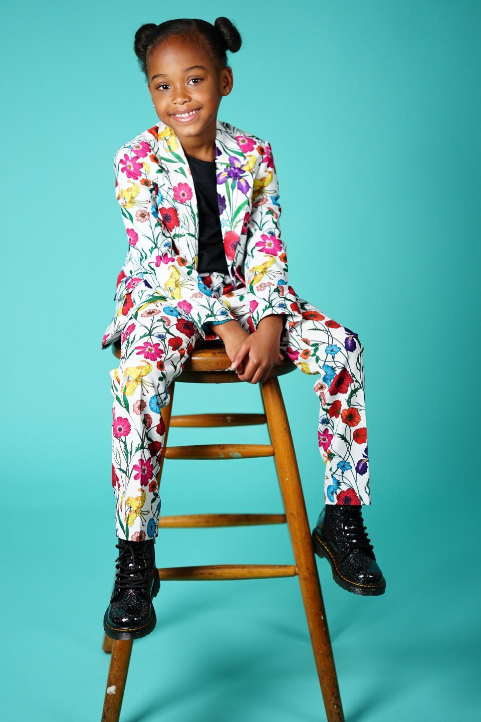 Model wearing floral suit.