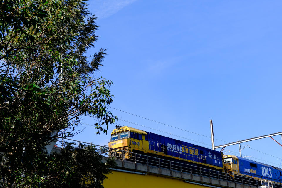 A deisel locomotive in an elevated train track