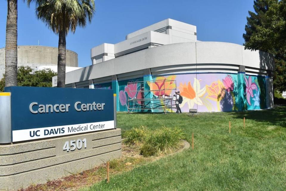 Ana Valentine’s “Withering Flowers Find Support” mural at the University of California, Davis Cancer Center for the Wide Open Walls festival 2021.