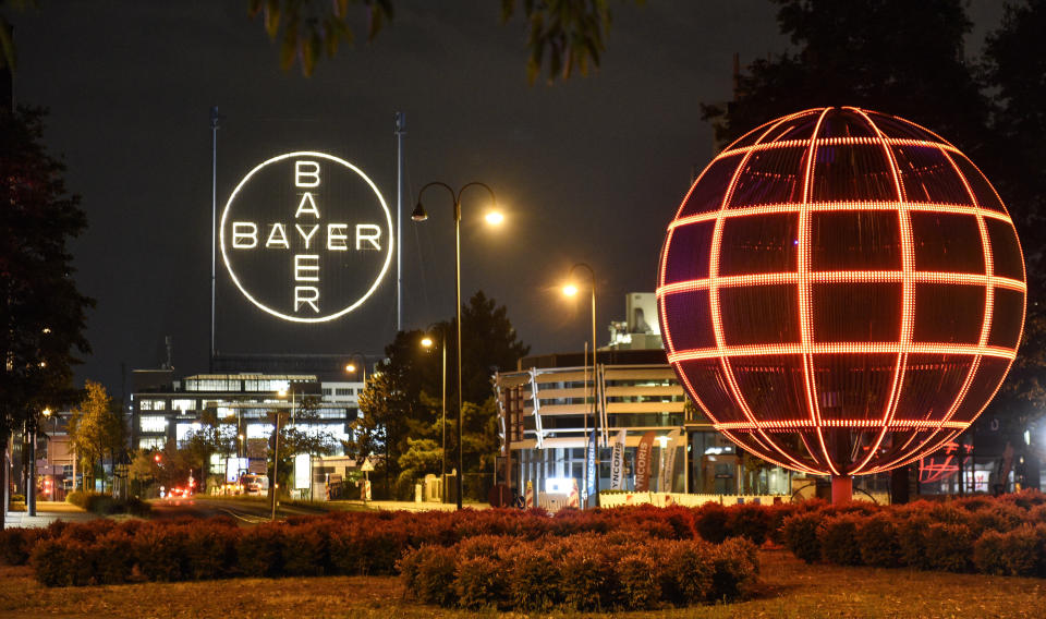 FILE - The Bayer logo is pictured at the main chemical plant of German Bayer AG on Thursday, Aug. 9, 2019 in Leverkusen, Germany. A low-rise city of 167,000 that grew up around the factories of the pharmaceuticals giant Bayer, Leverkusen has little to draw tourists besides its internationally famed soccer club. The team finished an entire German Bundesliga season unbeaten Saturday and is now targeting trophies in the Europa League and German Cup. (AP Photo/Martin Meissner, File)