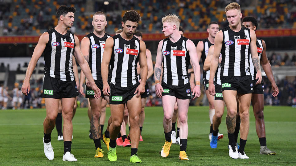 Collingwood players, pictured here after their loss to Geelong in the AFL semi-finals.