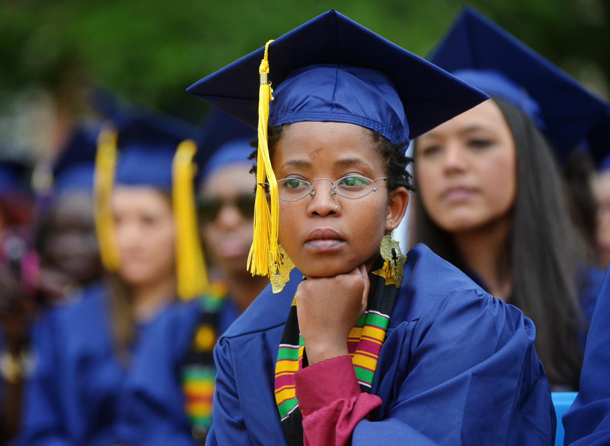 WASHINGTON, DC - MAY 10:
A graduate listens to the opening prayer during Howard University's commencement ceremonies on May, 10, 2014 in Washington, DC.
(Photo by Bill O'Leary/The Washington Post via Getty Images)