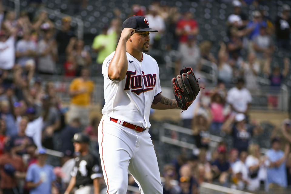 Minnesota Twins pitcher Jhoan Duran pumps his fist in celebration after the final out defeating the Chicago White Sox 6-3 during a baseball game, Saturday, July 16, 2022, in Minneapolis. (AP Photo/Craig Lassig)