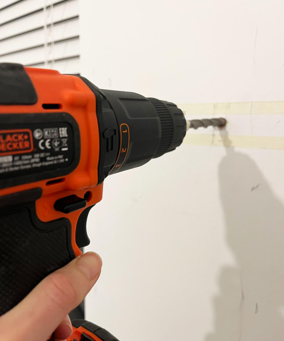 Drilling into masonry wall with hammer drill