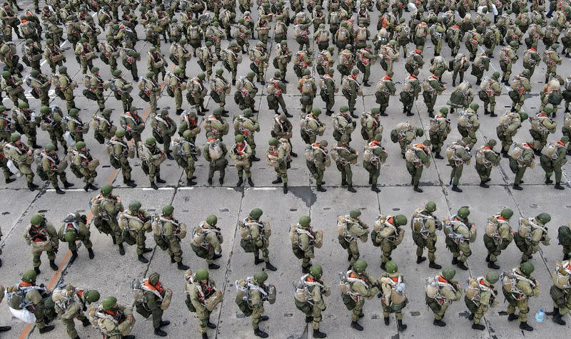 Russian paratroopers take part in drills at a military aerodrome in Taganrog