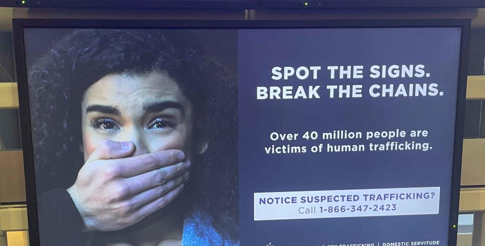 A sign instructing people to call if they suspect human trafficking.