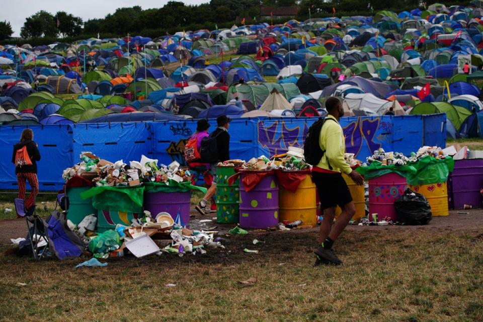 Waste left by festival goers waiting to be cleared at Worthy Farm in Somerset (Ben Birchall/PA) (PA Wire)