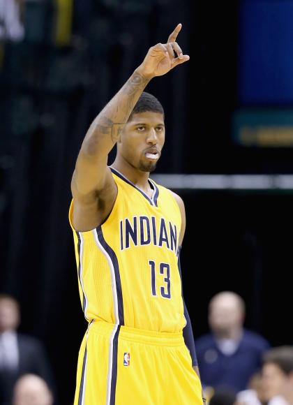 INDIANAPOLIS, IN - APRIL 05:  Paul George #13 of the Indiana Pacers celebrates in the game against the Miami Heat at Bankers Life Fieldhouse on April 5, 2015 in Indianapolis, Indiana.  Tonight is his first game this season .  NOTE TO USER: User expressly acknowledges and agrees that, by downloading and or using this photograph, User is consenting to the terms and conditions of the Getty Images License Agreement.  (Photo by Andy Lyons/Getty Images)