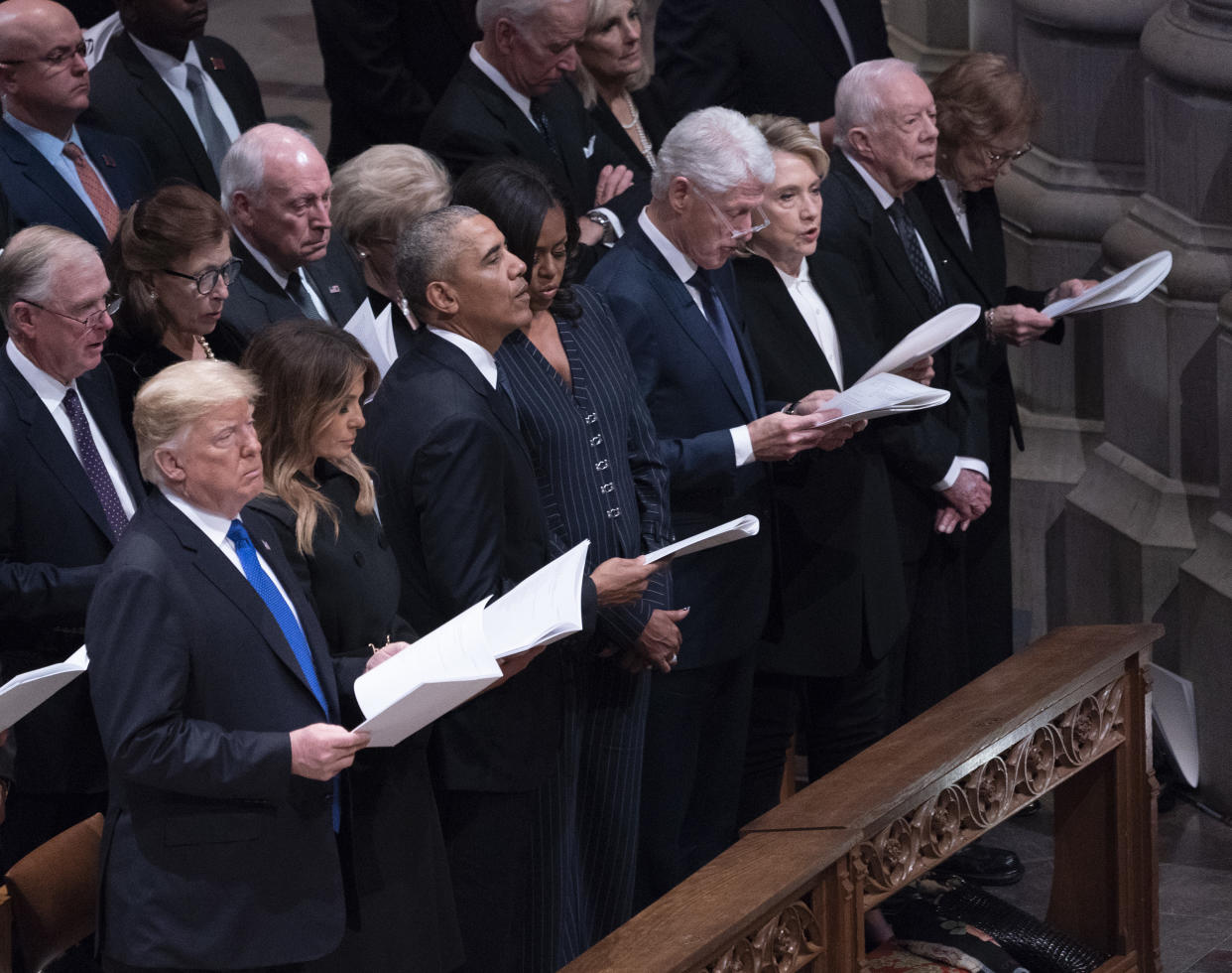 WASHINGTON, DC – DECEMBER 05: (AFP- OUT) United States President Donald J. Trump, First Lady Melania Trump, Barack Obama, Michelle Obama, Bill Clinton, Hillary Clinton, Jimmy Carter and Rosalyn Carter attend the state funeral service of former President George W. Bush at the National Cathedral, December 5, 2018 in Washington, DC. President Bush will be buried at his final resting place at the George H.W. Bush Presidential Library at Texas A&M University in College Station, Texas. A WWII combat veteran, Bush served as a member of Congress from Texas, ambassador to the United Nations, director of the CIA, vice president and 41st president of the United States. (Photo by Chris Kleponis-Pool/Getty Images)