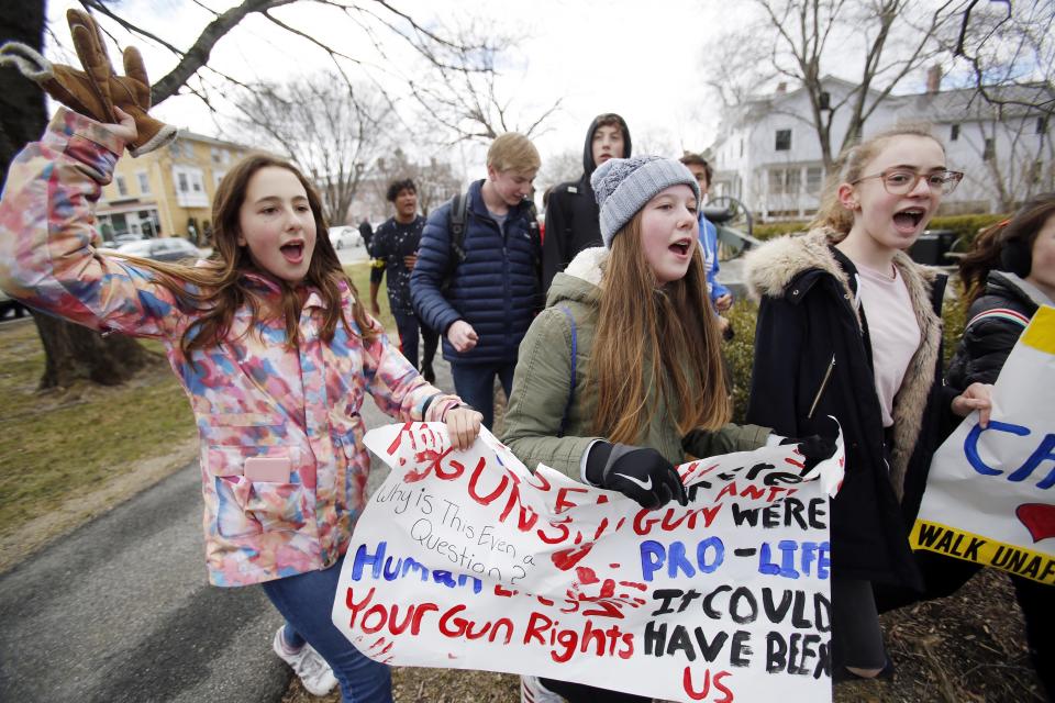 <p>Students and teachers from grades 6 to 8 leave the Berkshire Country Day School campus in Stockbridge and walk to downtown Lenox, chanting and holding signs against gun violence, Friday, April 20, 2018, as they taking part in a national school walkout event to protest gun violence. (Photo: Stephanie Zollshan/The Berkshire Eagle via AP) </p>