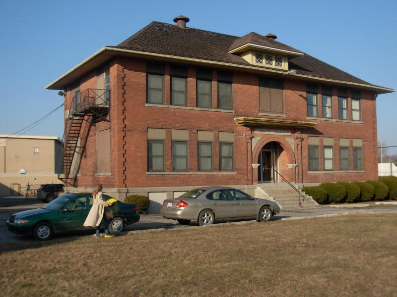 The Reading School building is shown.