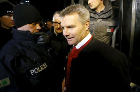 Politician Peter Dreier from the southeastern town of Landshut leaves a bus outside the Chancellery in Berlin, Germany, January 14, 2016.REUTERS/Fabrizio Bensch