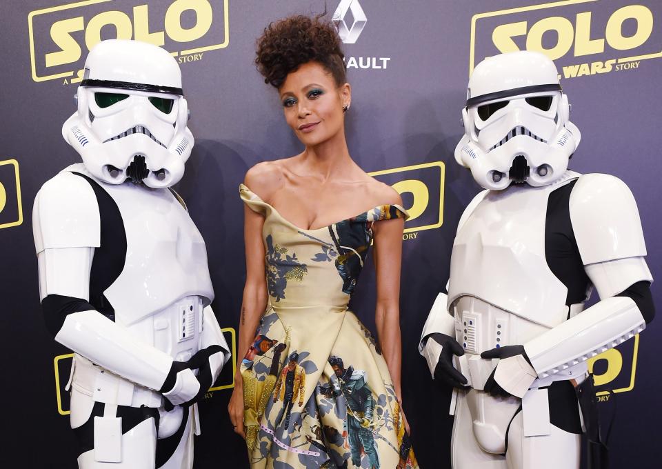 Thandiwe stands next to two Stormtroopers at the film's premiere