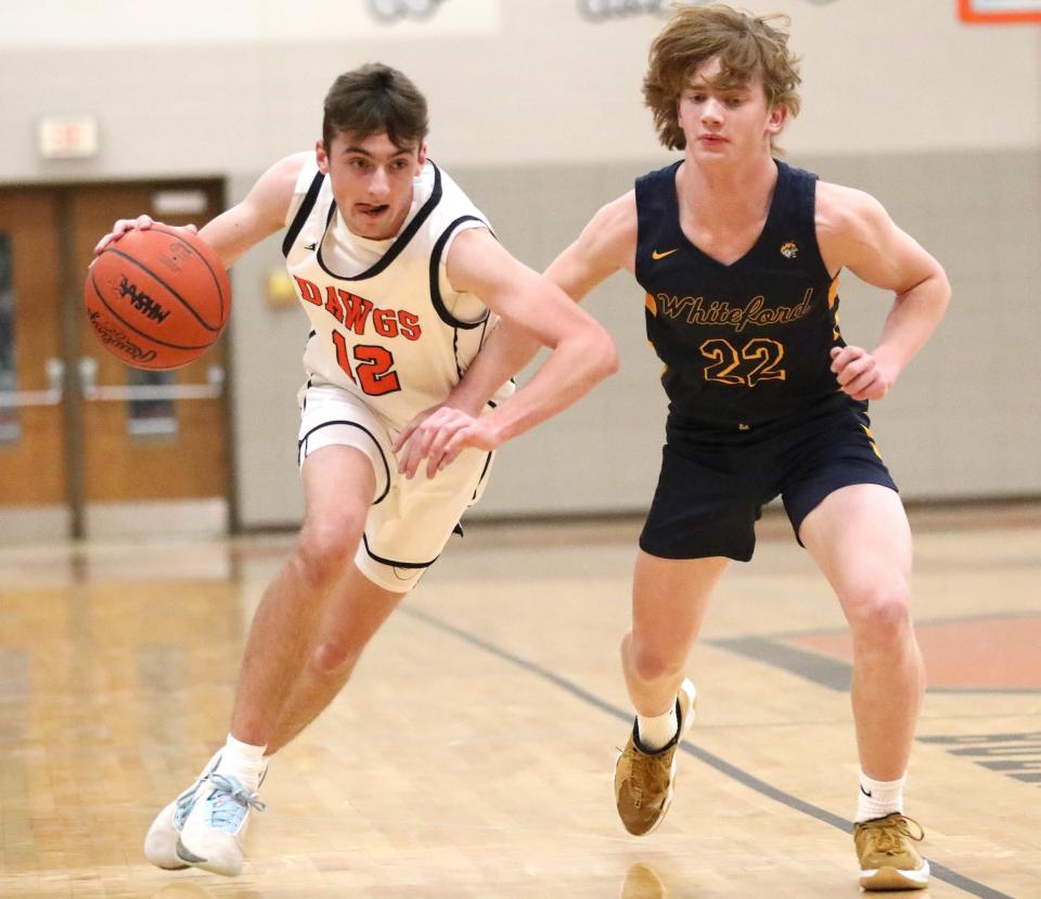 Tyler Dafoe of Summerfield goes to the basket against Whiteford's Ryin Ruddy during a 60-46 Summerfield victory Thursday night.