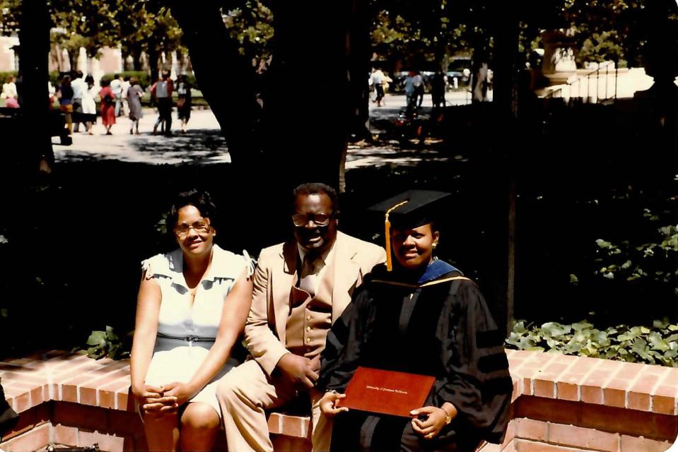 Earnest McEwen Jr., his wife, Mildred Blackmon McEwen, and their daughter Gloria after her doctoral graduation at the University of Southern California.