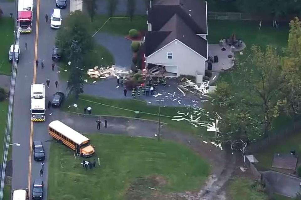 A school bush crashed into a home in Edison, New Jersey on Oct. 18, 2023. Two students suffered minor injuries, said officials