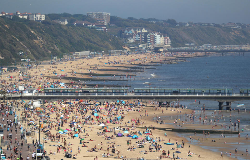 People enjoy the hot weather at Bournemouth beach in Dorset