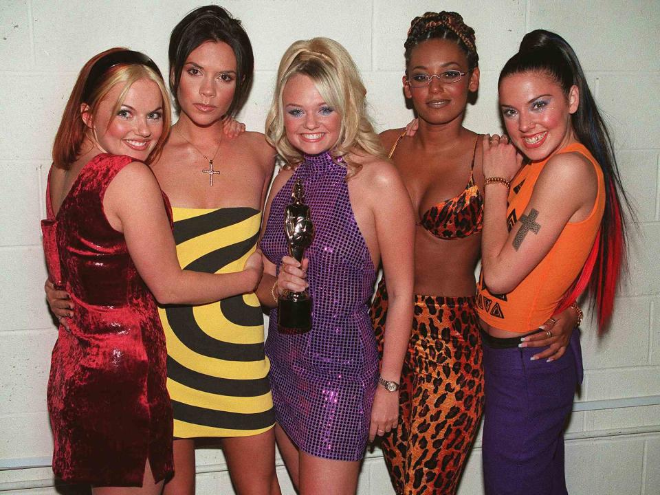 <p>Dave Hogan/Getty </p> The Spice Girls after the 1998 Brit Awards in London