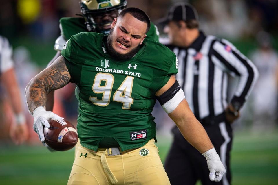 Colorado State Rams defensive lineman Cam Bariteau celebrates after recovering a fumble against the Utah State Aggies during their game at Canvas Stadium in Fort Collins on Oct. 15, 2022.