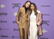 FILE - Actresses Evan Rachel Wood, left, and Gina Rodriguez attend the premiere of "Kajillionaire" during the 2020 Sundance Film Festival in Park City, Utah on Jan. 25, 2020. The film is about a family of grifters in Los Angeles. (Photo by Arthur Mola/Invision/AP, File)