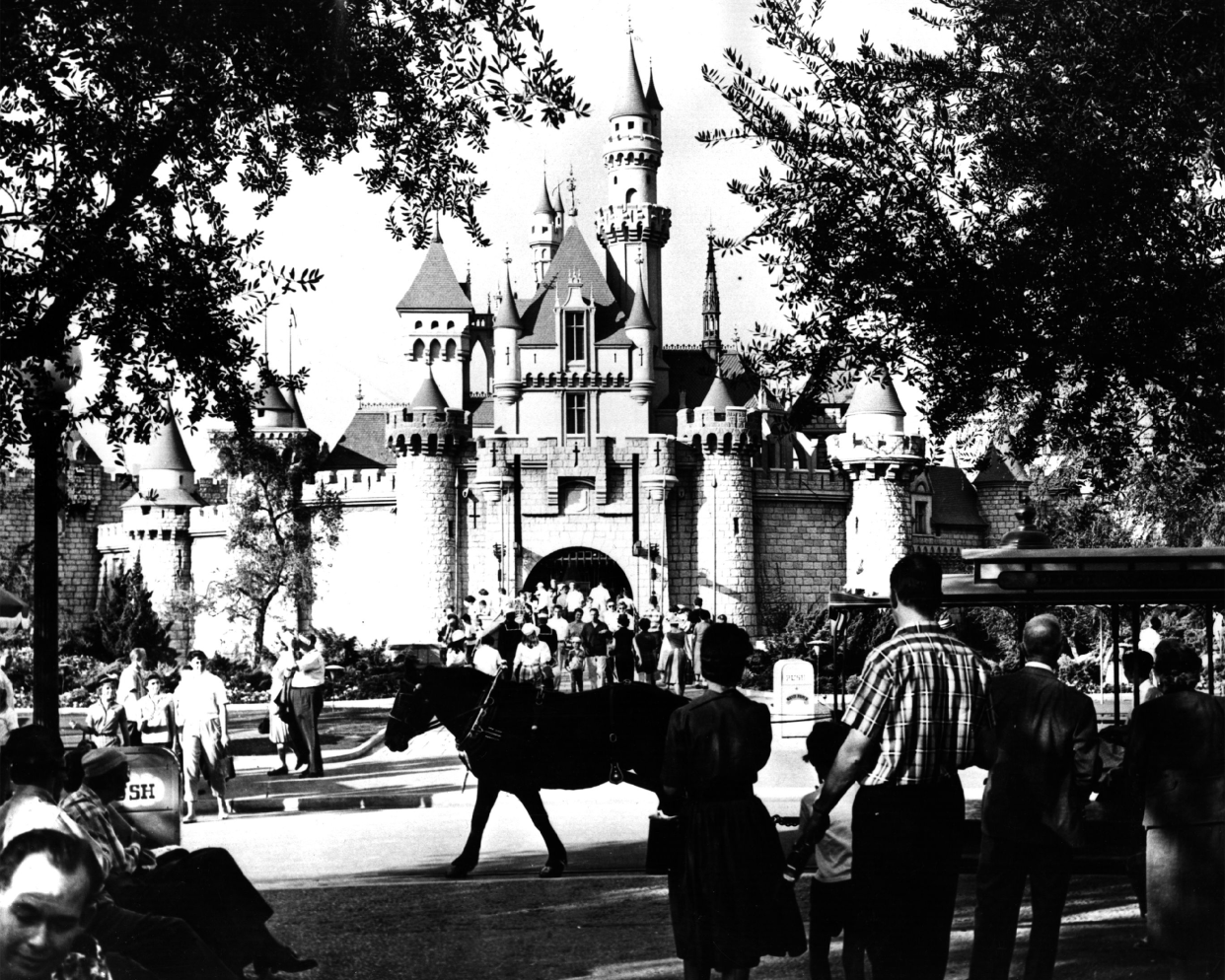 Tourists visiting the medieval 'Sleeping Beauty Castle' at Disneyland.