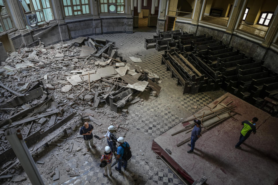 Rev. Barbaro Abel Marrero Castellanos, president of the Baptist Convention of Western Cuba, is interviewed inside the the Calvary Baptist Church damaged by an explosion that devastated the Hotel Saratoga, in Old Havana, Cuba, Wednesday, May 11, 2022. “We still don't know exactly the magnitude of the damage," said Marrero Castellanos, adding that some specialists have said they might have to evaluate possibly demolishing parts of the structure. (AP Photo/Ramon Espinosa)