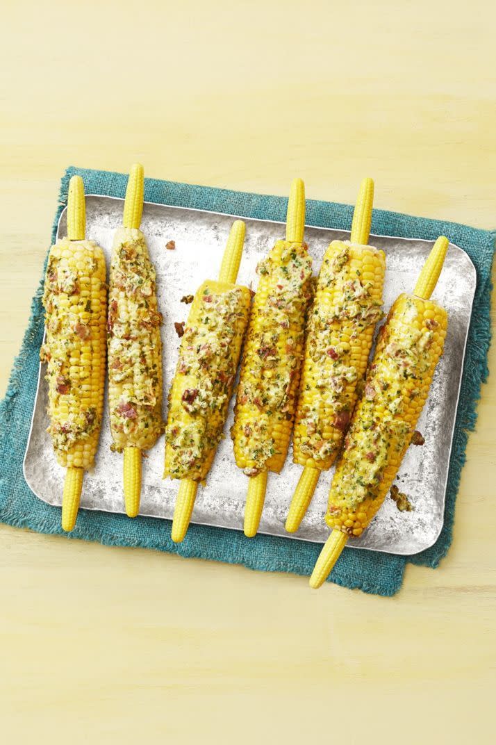 <p>Grilled corn on the cob is a classic for any backyard barbecue. But this one takes things to the next level thanks to the spicy bacon butter slathered on top. </p><p><a href="https://www.thepioneerwoman.com/food-cooking/recipes/a32345419/grilled-corn-with-spicy-bacon-butter-recipe/" rel="nofollow noopener" target="_blank" data-ylk="slk:Get Ree’s recipe.;elm:context_link;itc:0;sec:content-canvas" class="link "><strong>Get Ree’s recipe.</strong></a></p><p><a class="link " href="https://go.redirectingat.com?id=74968X1596630&url=https%3A%2F%2Fwww.walmart.com%2Fsearch%2F%3Fquery%3Dcorn%2Bholders&sref=https%3A%2F%2Fwww.thepioneerwoman.com%2Ffood-cooking%2Fmeals-menus%2Fg36353420%2Ffourth-of-july-side-dishes%2F" rel="nofollow noopener" target="_blank" data-ylk="slk:SHOP CORN HOLDERS;elm:context_link;itc:0;sec:content-canvas">SHOP CORN HOLDERS</a></p>